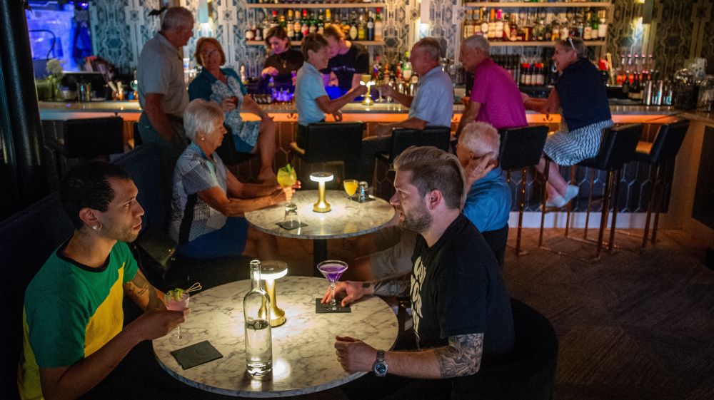 Guests enjoy drinks at Corpse Reviver in Durham, NC.