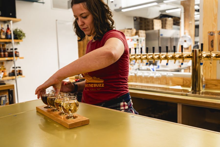 A bartender lines up a flight of mead at Ment Beverage Co.