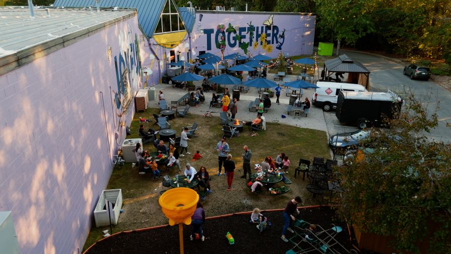 Guests enjoy an evening outdoors on the patio at The Glass Jug's RTP location.