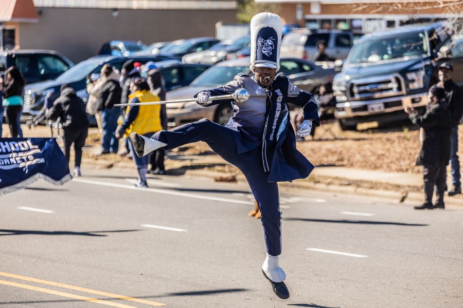 A band member of Hillside High School performs in a parade