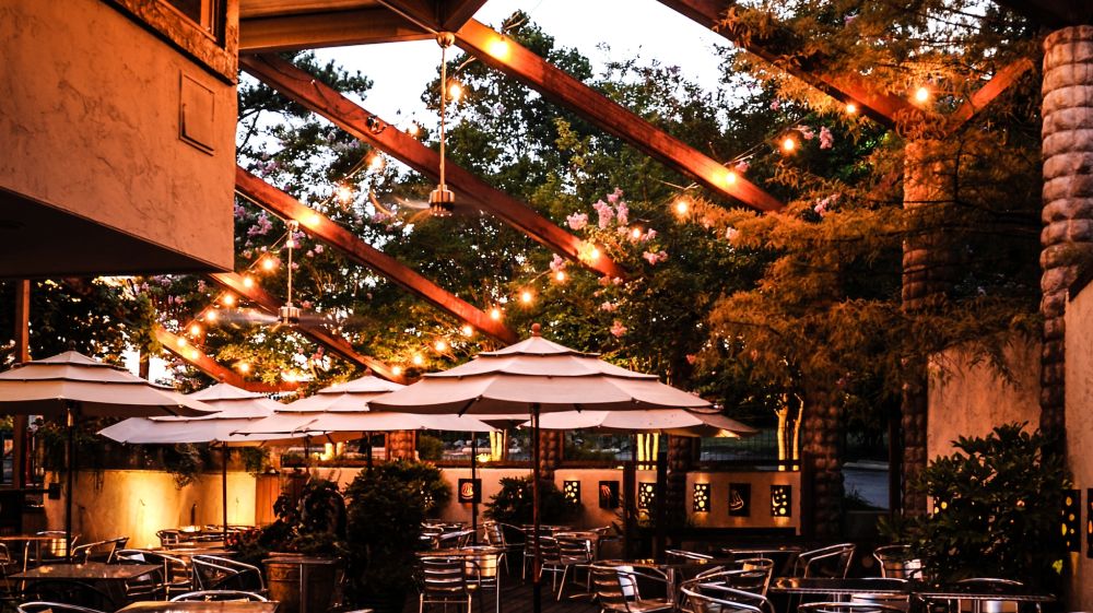 Lights shine over the outdoor patio at Guglhupf in Durham, NC.
