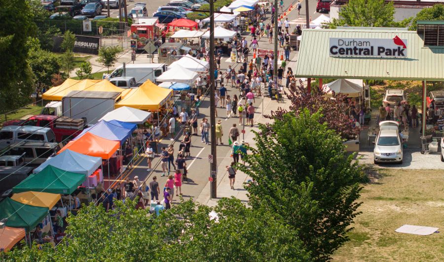 Attendees at the weekly farmers' market in Durham's Central Park.