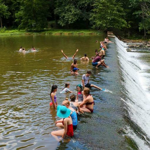 People swimming in the Eno River at Westpoint on the Eno. Durham, NC
