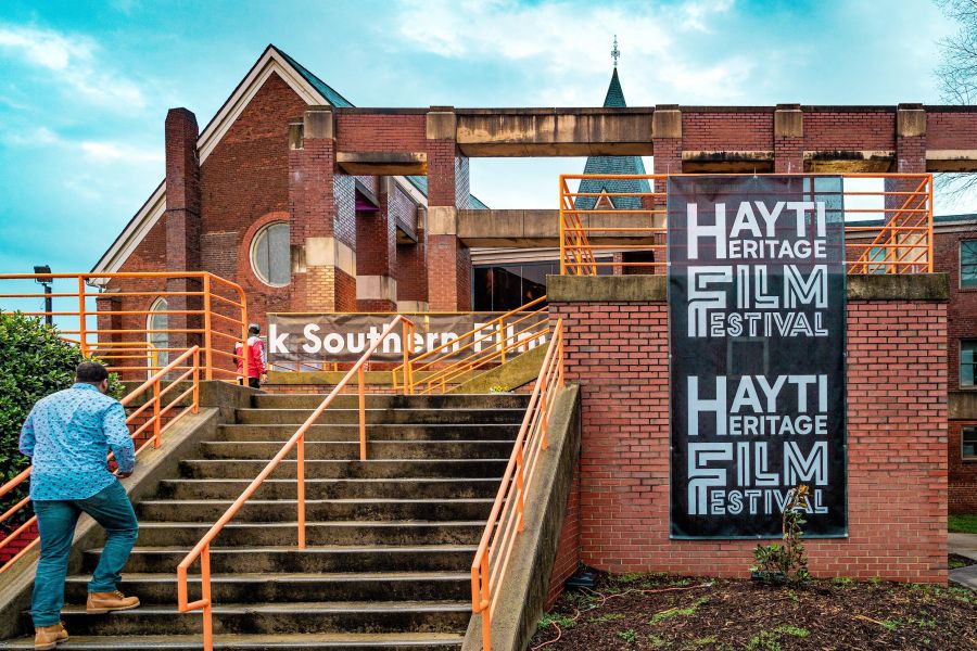 A guest walks up the steps on their way into the Hayti Heritage Film Festival in Durham.