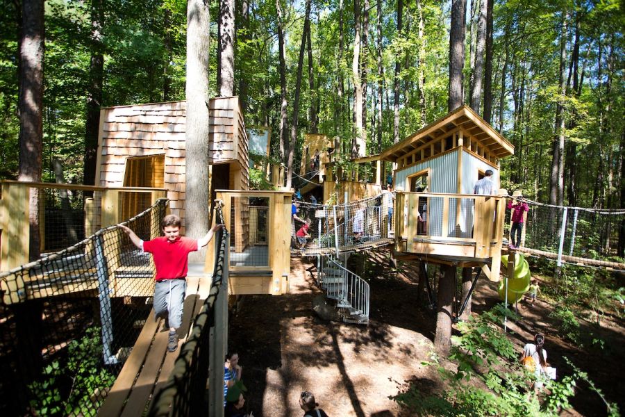 Children play in the treehouses at Hideaway Woods at the Museum of Life and Science in Durham, NC.