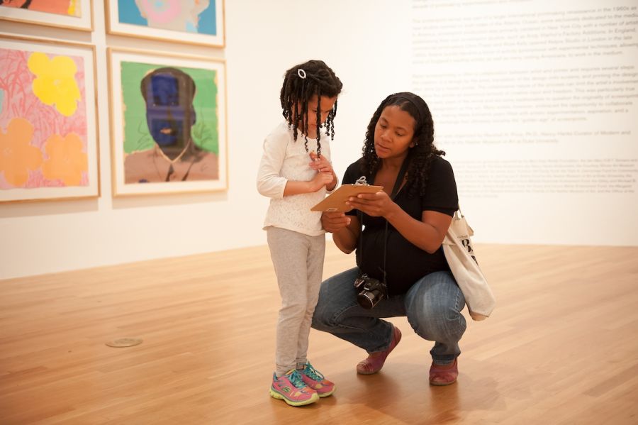 A child stands with their mother at The Nasher Museum on Duke University West Campus.
