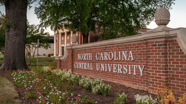 Plants surround the main sign on North Carolina Central University's campus.