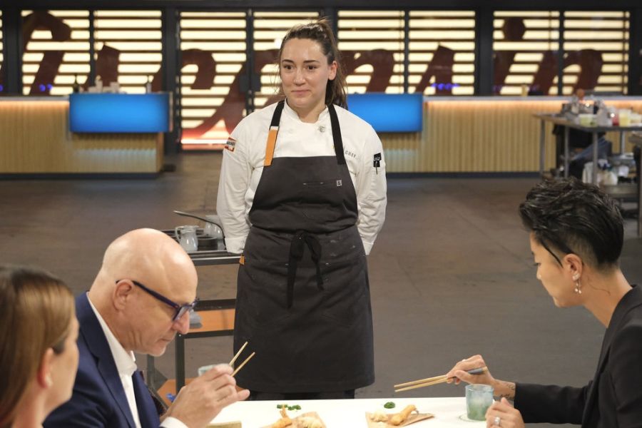 Durham Chef Savannah Miller stands before the judges on the set of Top Chef Season 21.