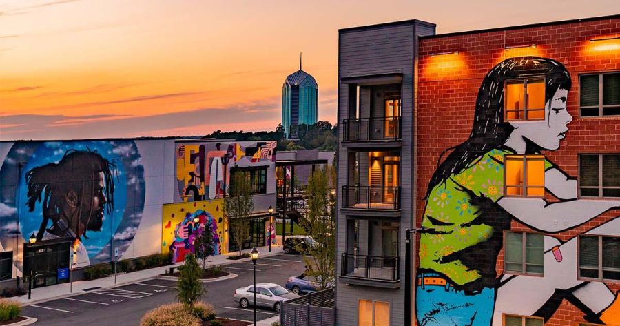 The UHill murals stand on full display at sunset.